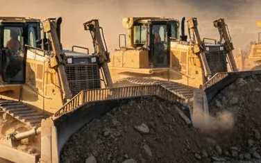 Dressta heavy bulldozers on a construction site - crawler dozers at work